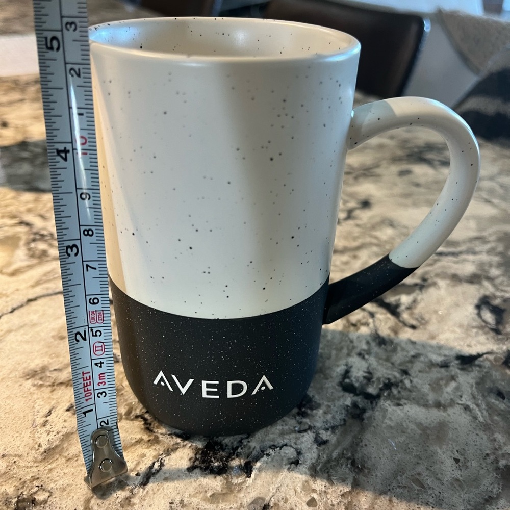 Cream and black  AVEDA coffee mug cup